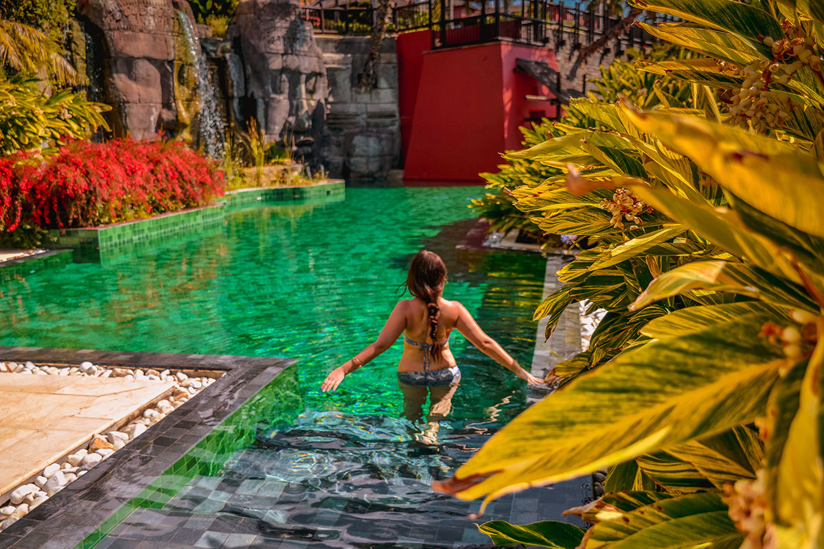 Stepping into a pool at Hotel Asia Garden