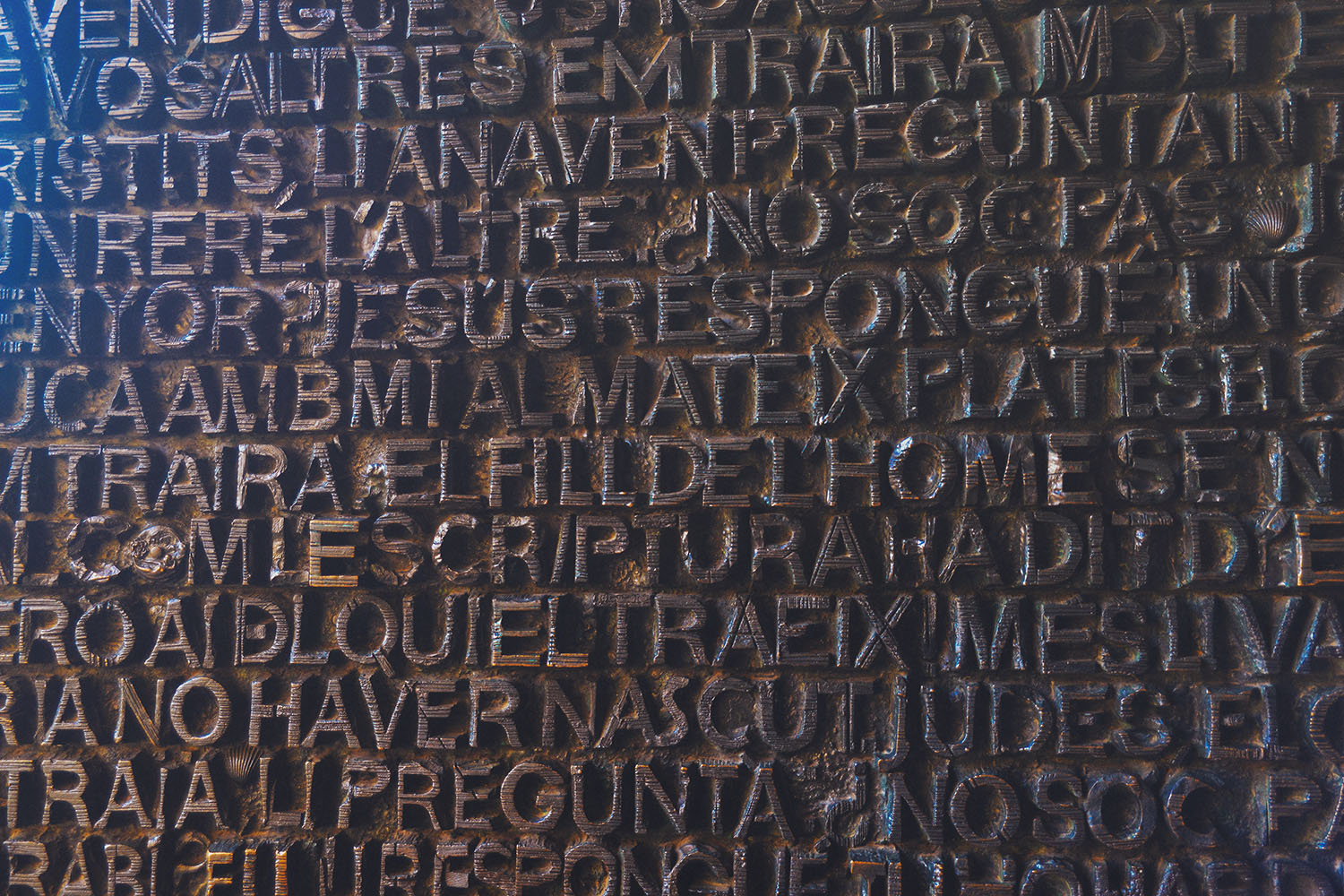 Wood door with carved letters and words