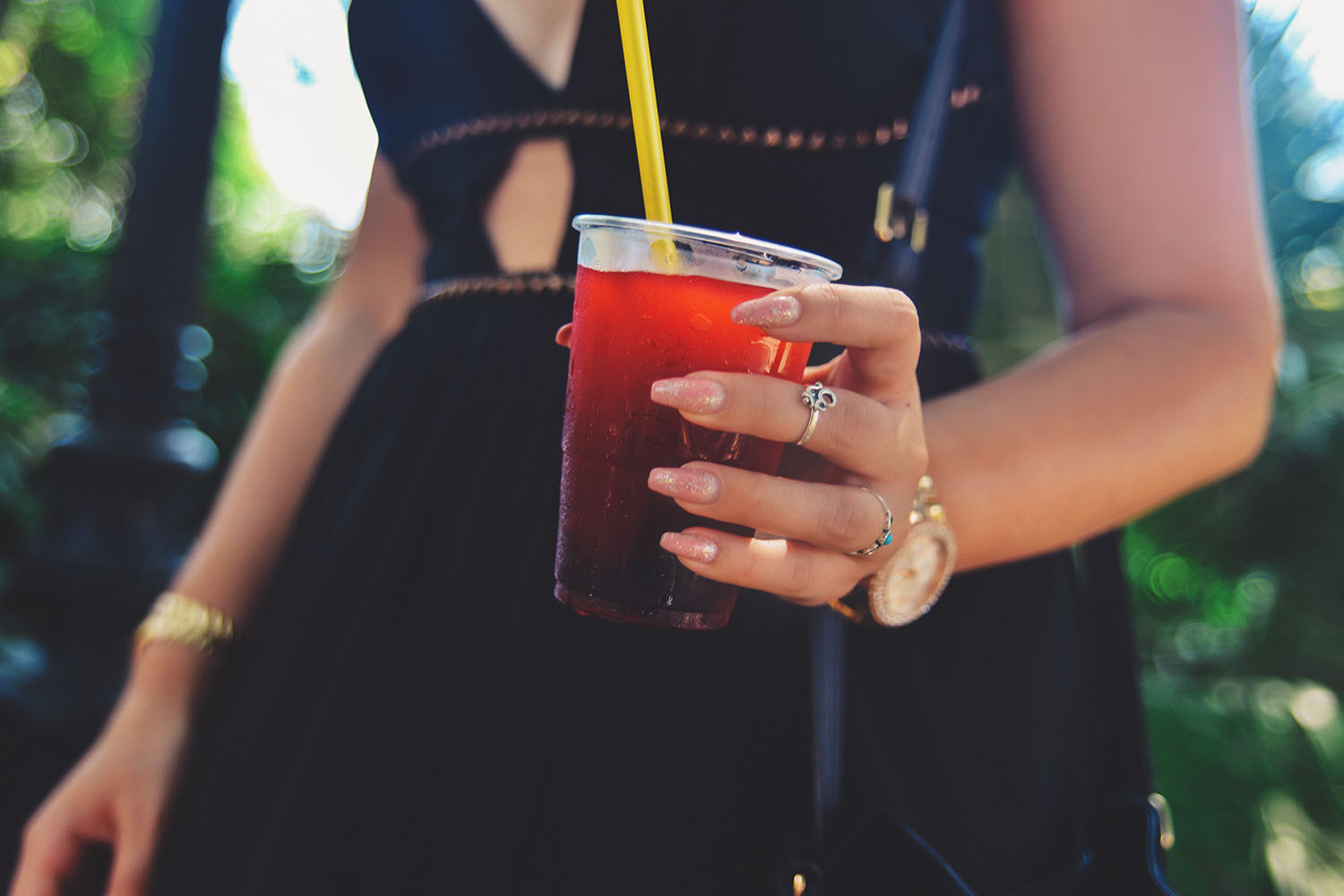 Holding a glass of strawberry slush