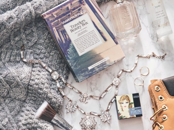 UK Travel Essentials - Flatlay with cosy knit, Timberland & my essentials to United Kingdom