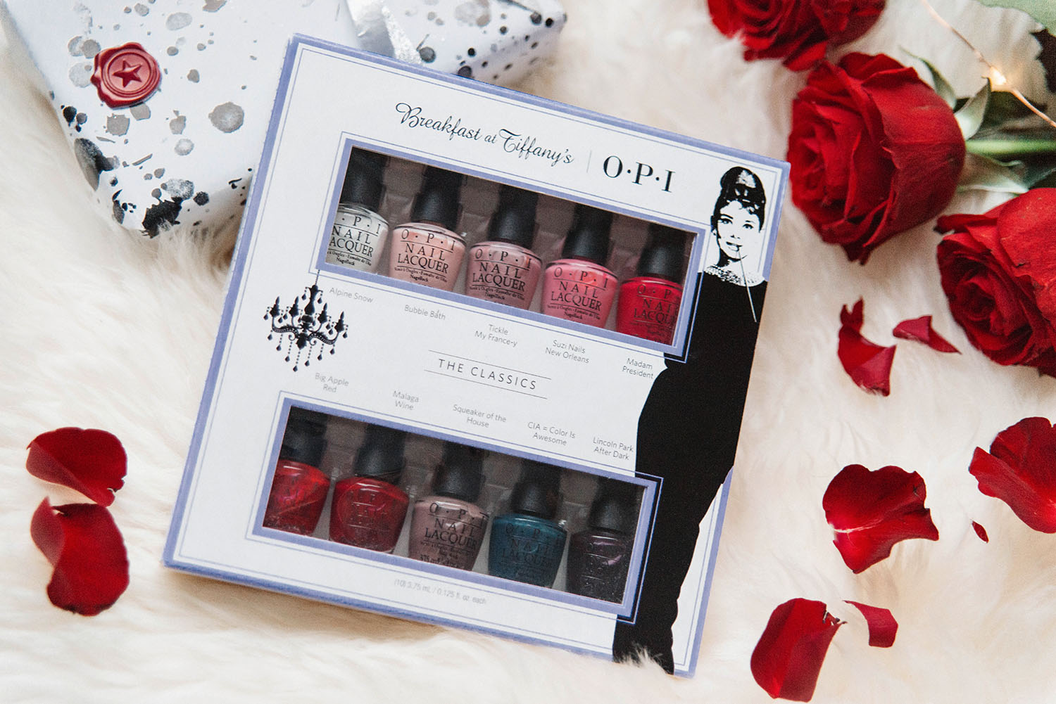 Flatlay with OPI Breakfast at Tiffanys pack with scattered roses