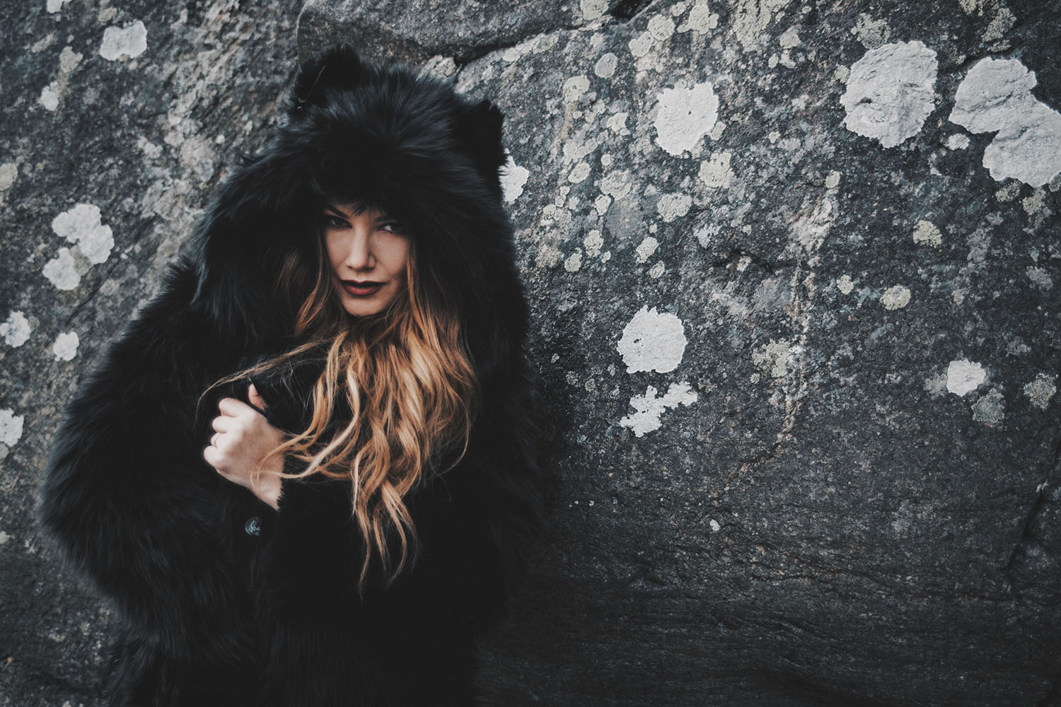 Woman with black faux fur coat with ears from Spirithood