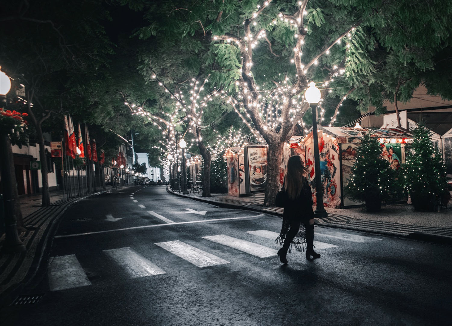 Woman walking across street in Madeira