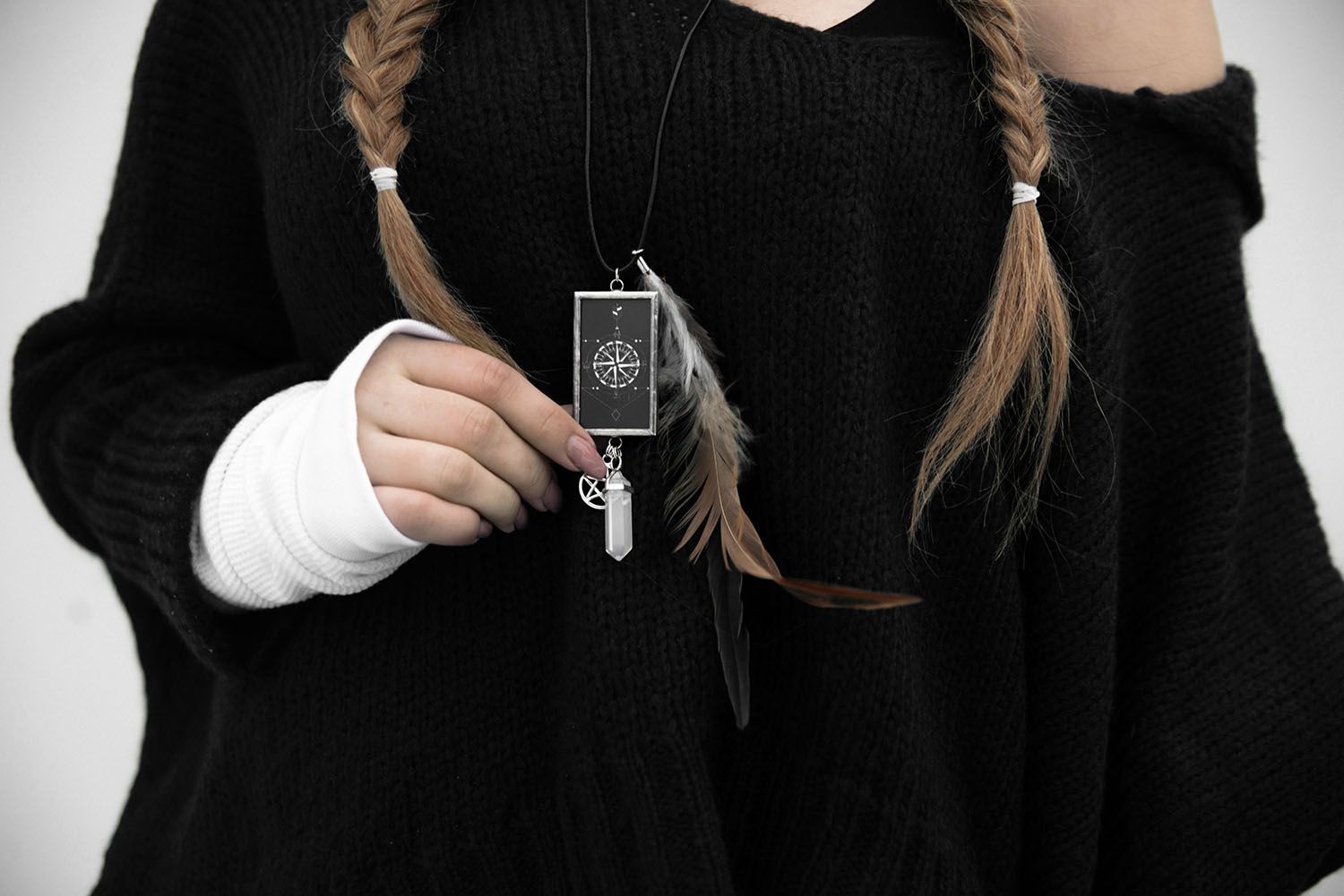 Girl with braids holding handmade necklace from Marielle Designs