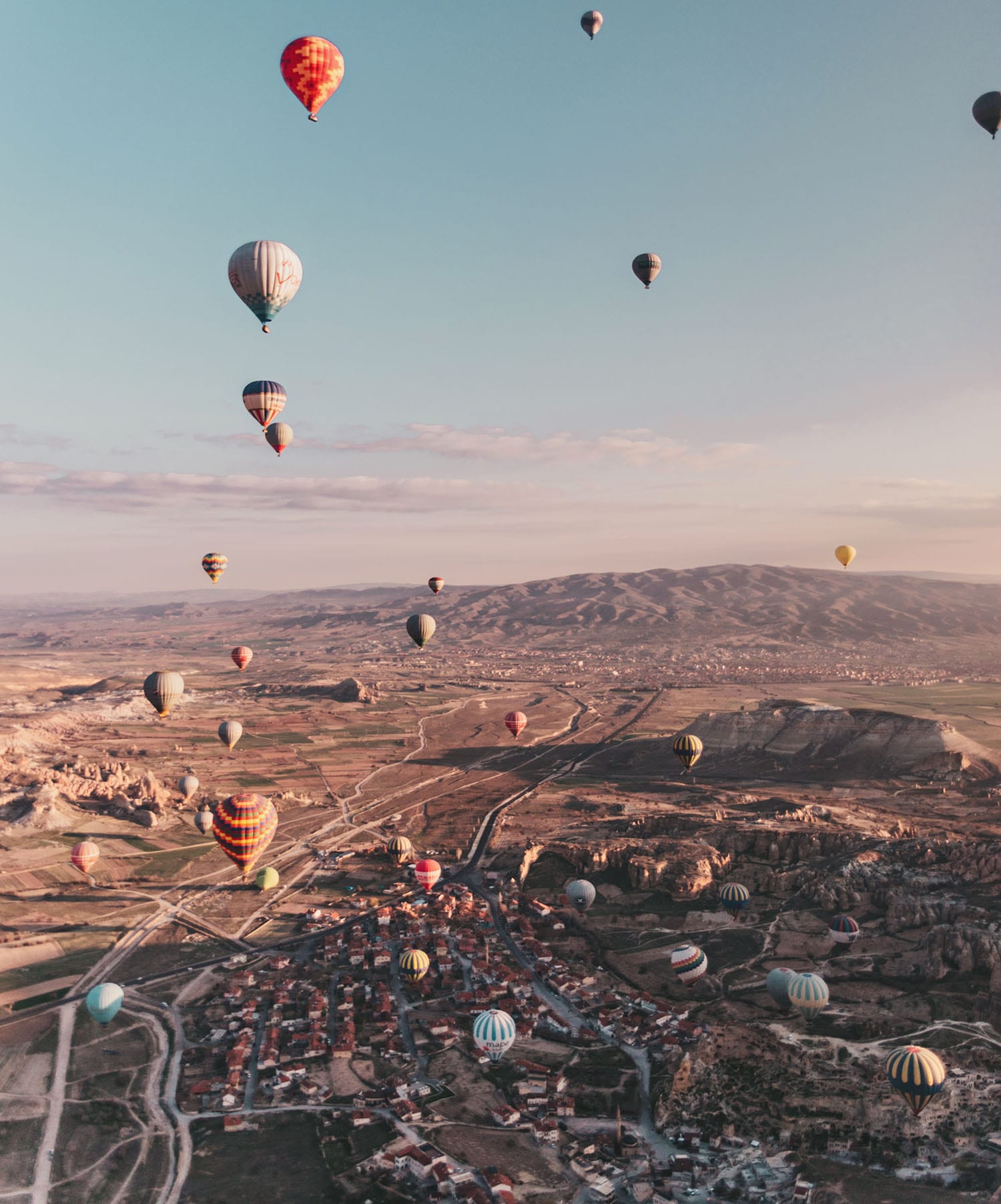 A surreal view of hot air balloons in Cappadocia, Turkey