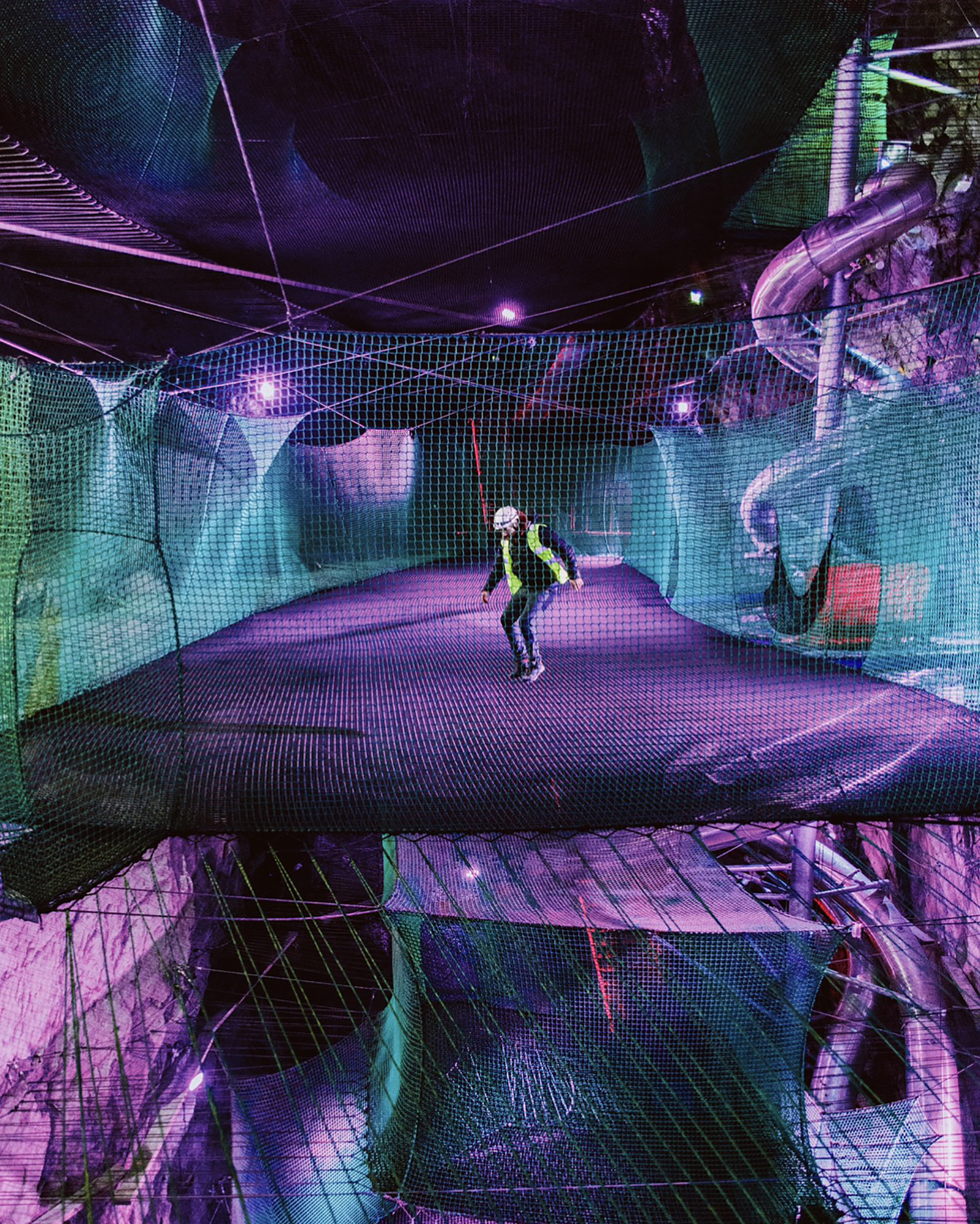 Man bouncing in Bounce Below - Underground Trampolines in North Wales