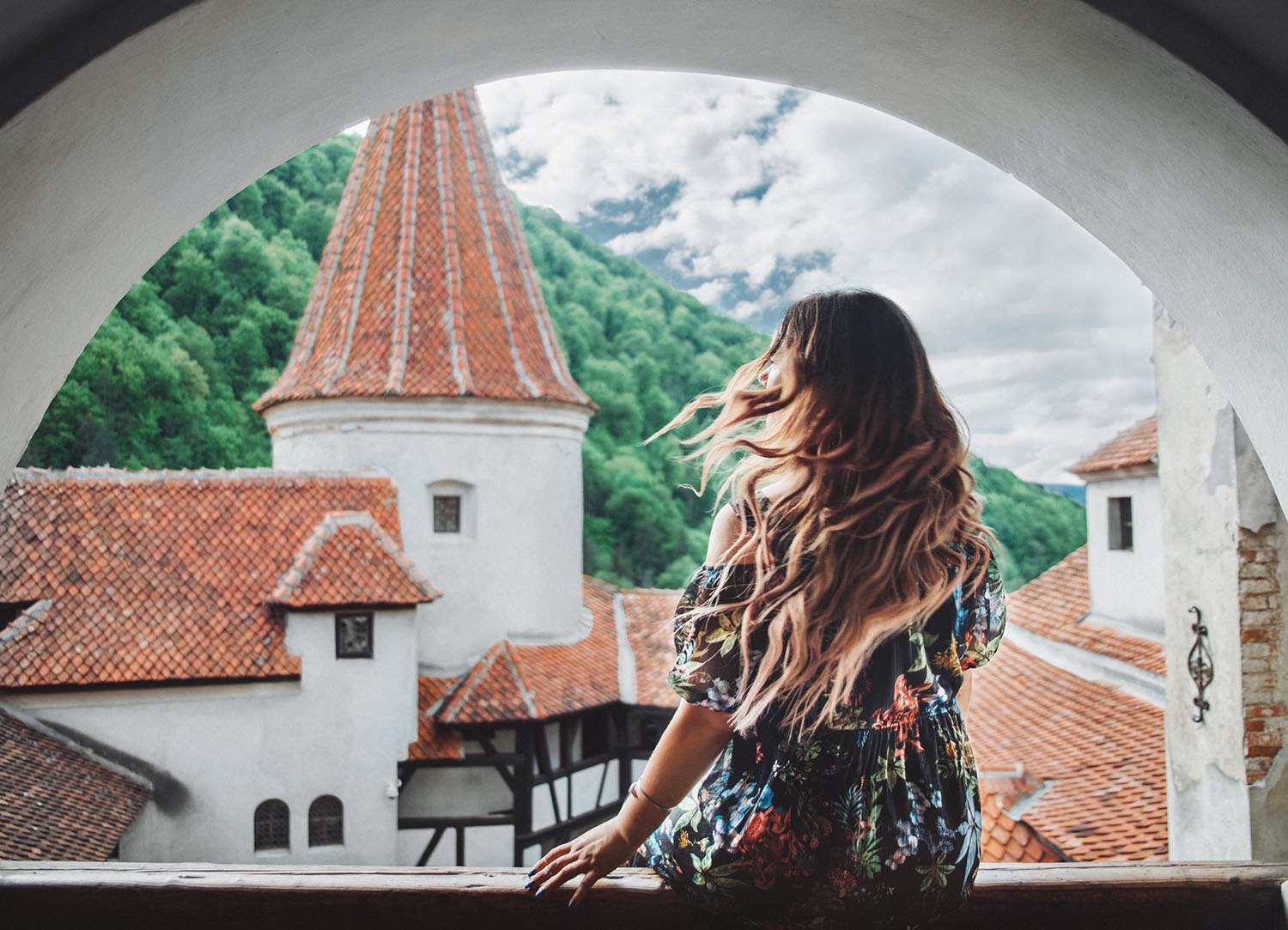 ADARAS sitting in front of Dracula's Castle, Bran Castle in Transylvania