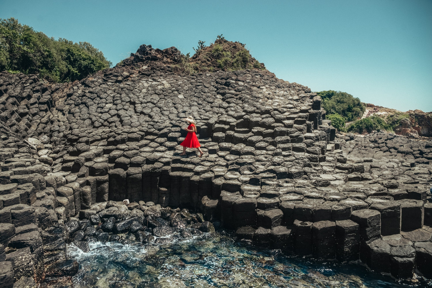 Adaras at Ganh Da Dia in Phu Yen, Vietnam | Girl in Red Dress Walking on basalt rock columns