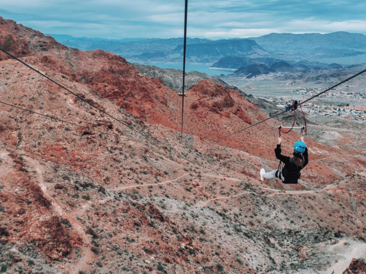 Photo of woman ziplining over the Mojave Desert with Flightlinez
