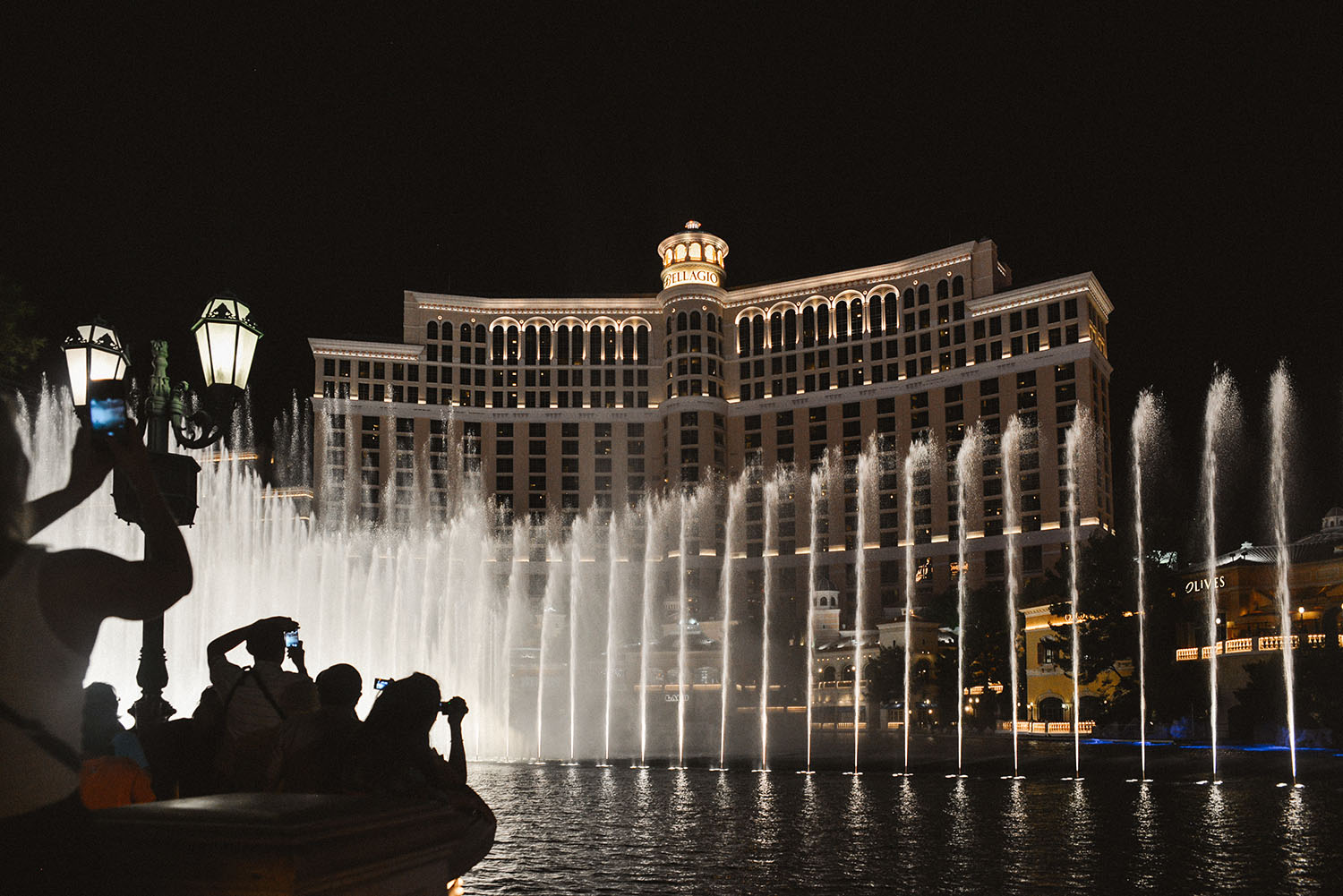 People taking photos of Fountains of Bellagio in Las Vegas