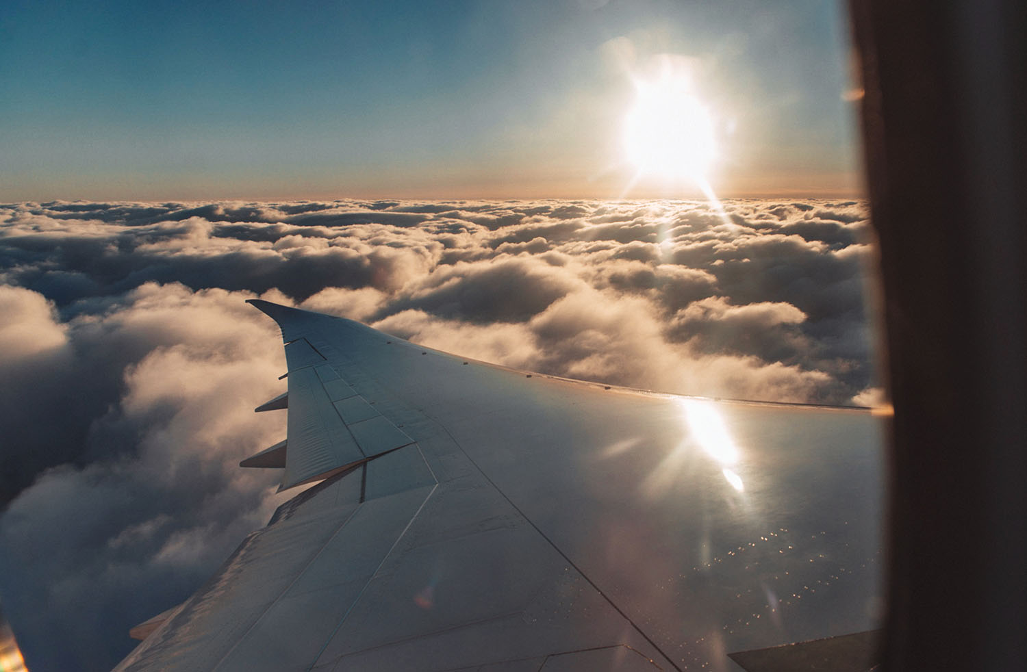 Airplane view: Sunset over clouds